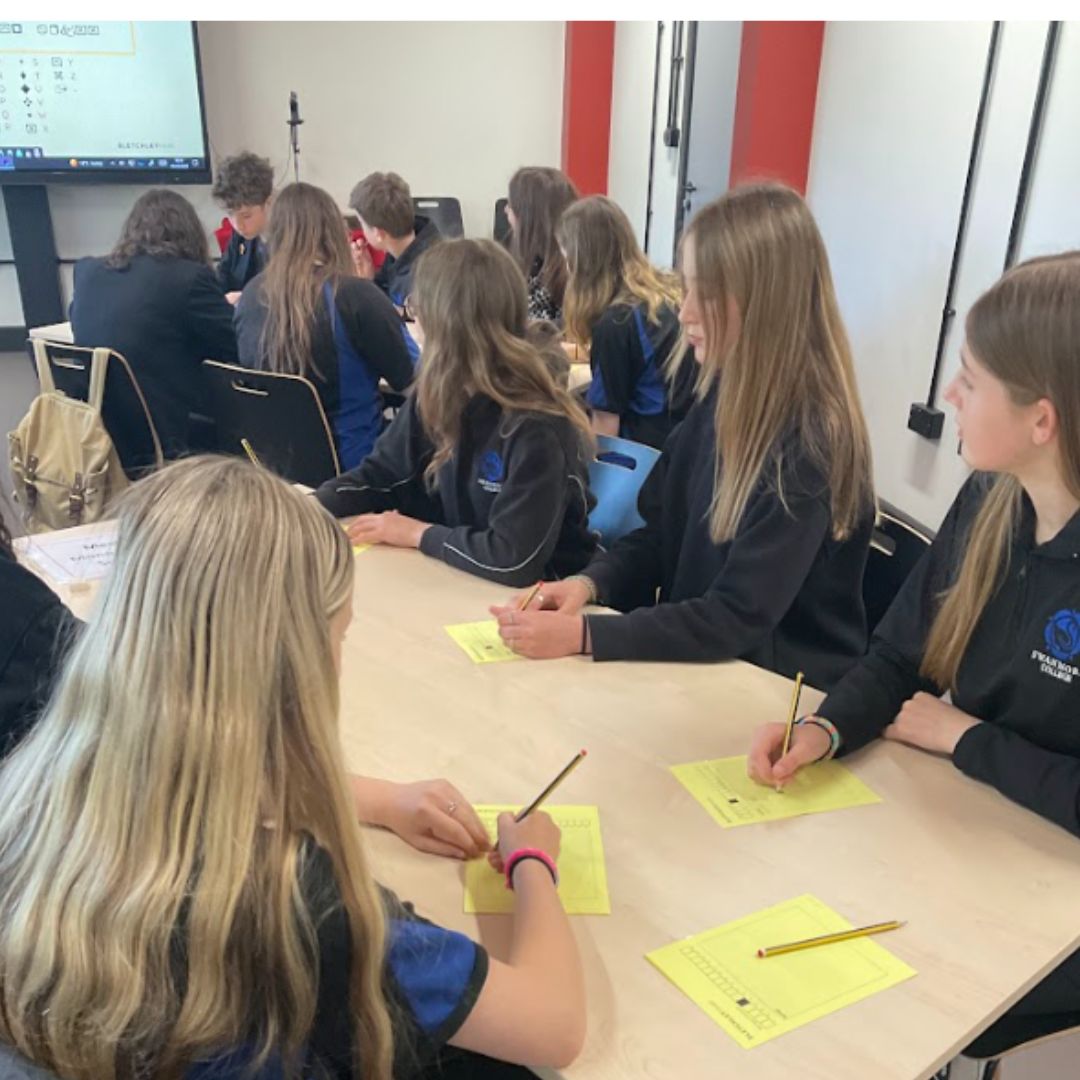 Image shows the pupils working on an activity lead by staff at Bletchely Park