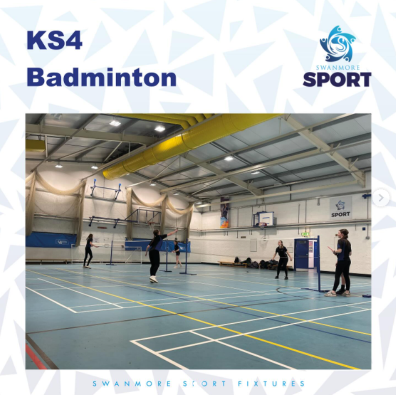 Image shows the inside of the Swanmore College sports hall with 2 badminton matches being played by some of our key stage 4 teams.