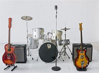 Image shows musical instruments set up for a band - electric guitar, bass, microphone and a drum kit