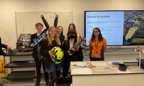 Image shows 5 pupils with Erin Williams from McLaren Racing